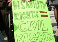 a homemade sign reading disability rights equal civil rights